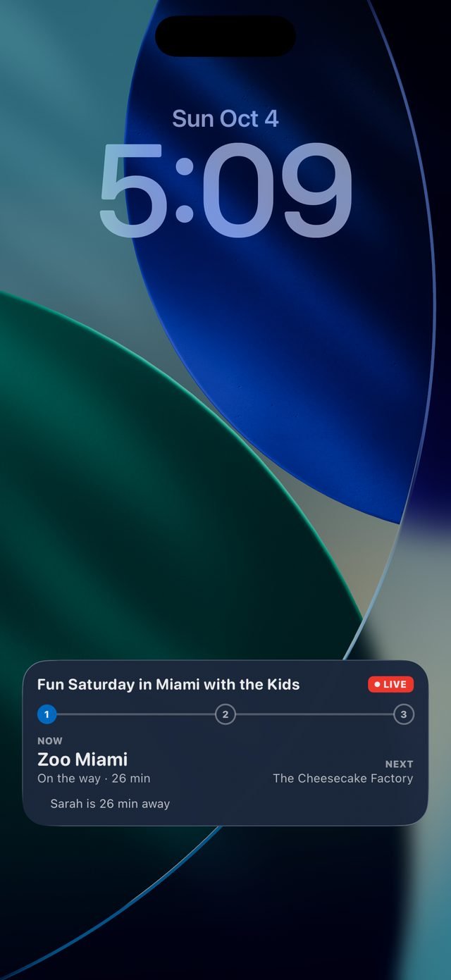 The FamTrip3 Live Activity on the iPhone lock screen: now Zoo Miami, next The Cheesecake Factory, Sarah 26 minutes away